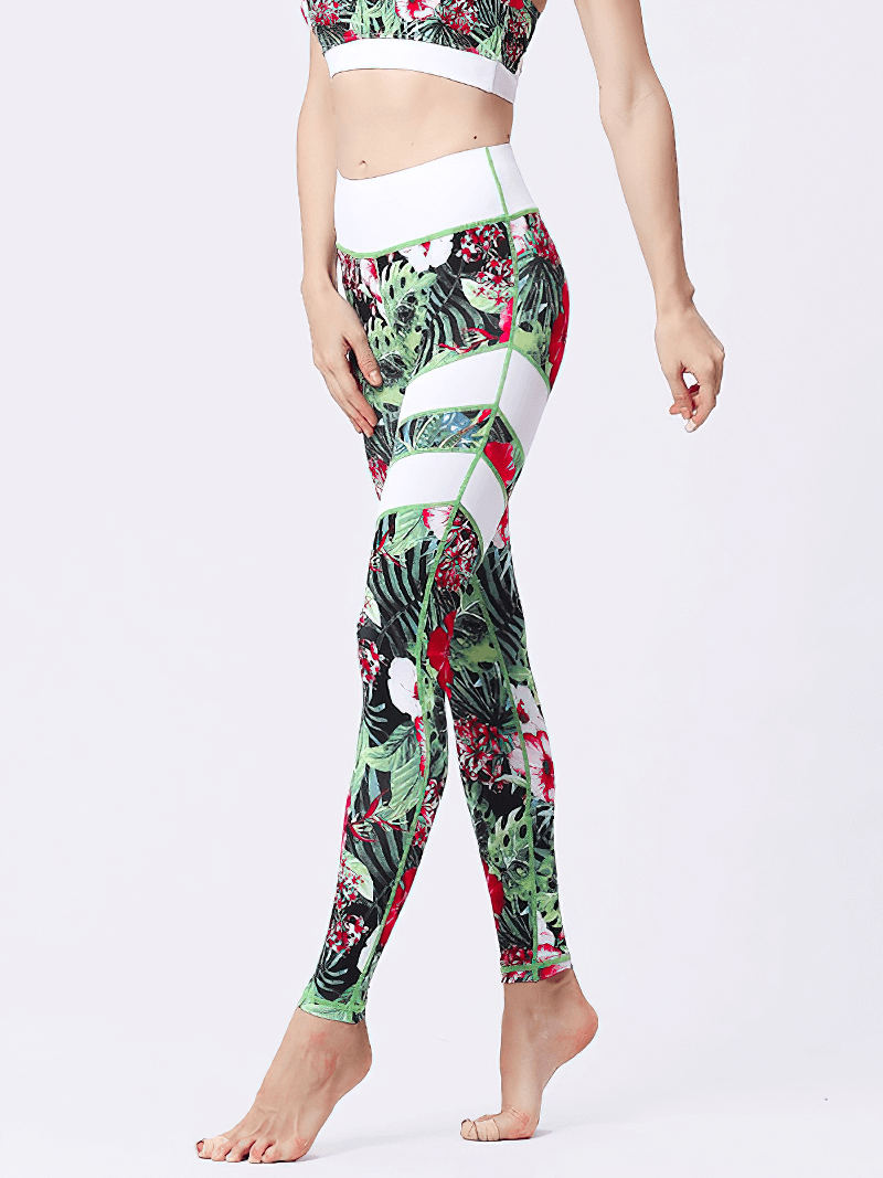 Woman modeling high-waist sports leggings with floral print, showcasing full-length design and elastic waist for yoga and fitness.